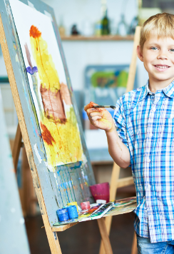 happy-little-boy-enjoying-art-class-GB3RZHU-1.png